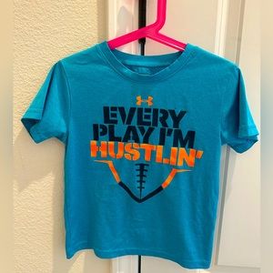 Boy UA blue teal performance “every play I’m hustlin” football tshirt. Size5